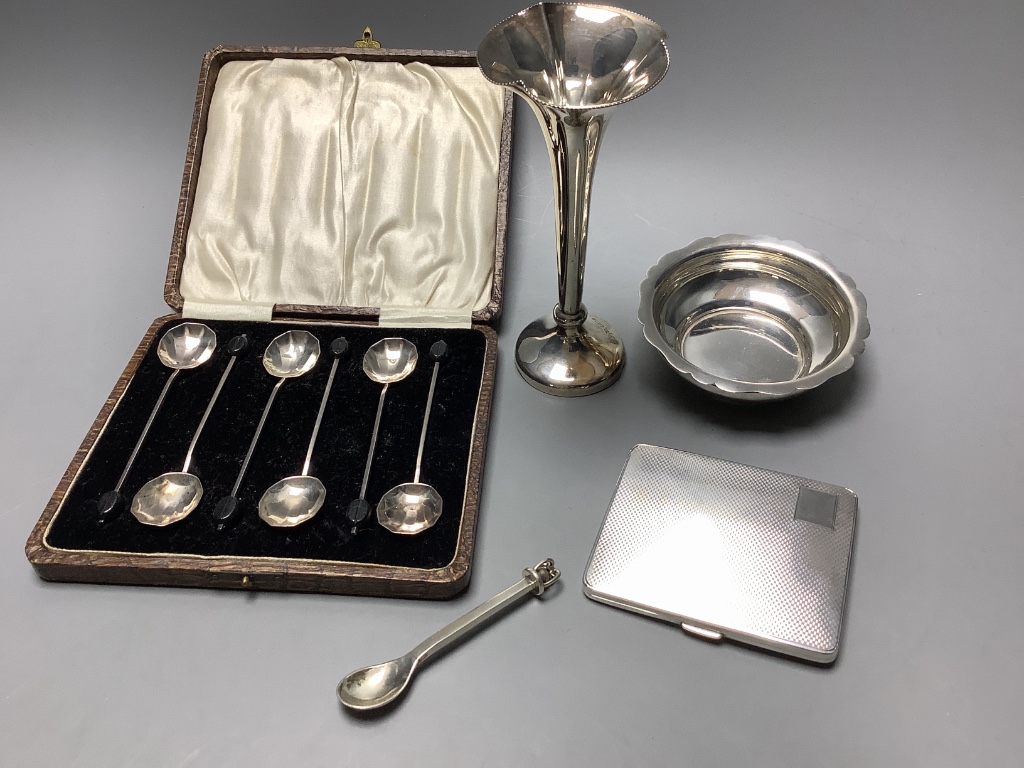 A silver cigarette case, coffee spoons, small bowl, vase and a small modern spoon by Guild of Handicrafts.